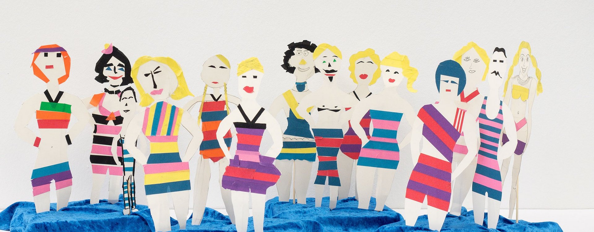 Kunstvermittlung Aus bunten Papierstreifen gestaltete Menschengruppe